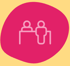 Two people at a desk icon representing an assessment meeting