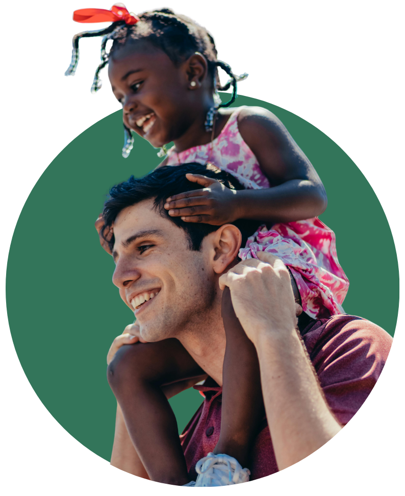 fostering in buckinghamshire Young girl smiling while riding on her foster carer's shoulders