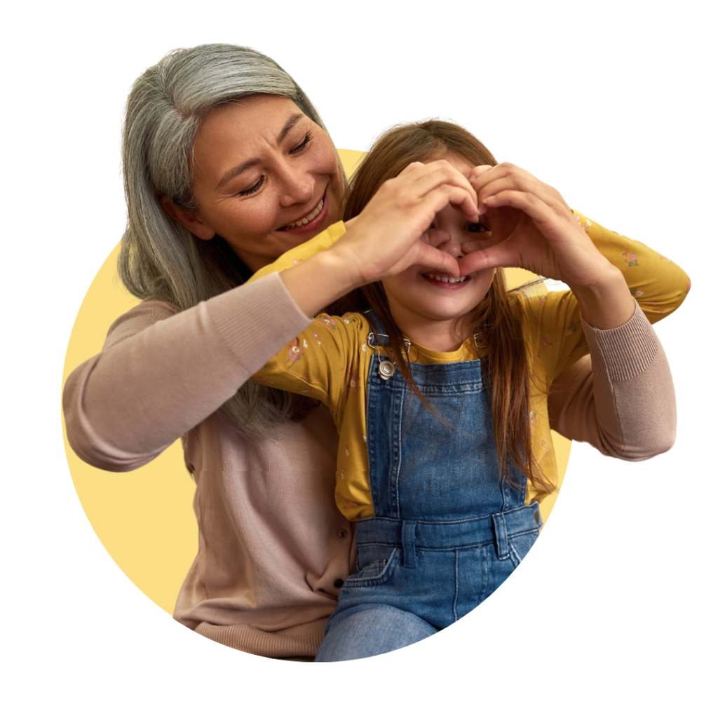 foster carer pay & Foster carer and young girl making a heart shape with their hands